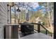 Outdoor deck featuring a built-in stainless grill, and a patio umbrella at 188 Winding Forest Dr, Troutman, NC 28166