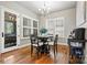 Bright breakfast nook featuring natural light, a modern chandelier and hardwood floors at 188 Winding Forest Dr, Troutman, NC 28166