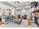 Inviting living room featuring a stone fireplace, hardwood floors, and plush seating at 188 Winding Forest Dr, Troutman, NC 28166