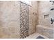 The bathroom features a tiled shower with mosaic detailing, bench, and bronze fixtures at 188 Winding Forest Dr, Troutman, NC 28166