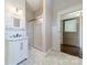 Elegant bathroom featuring a marble vanity, tiled shower, and classic fixtures at 234 N Race St, Statesville, NC 28677