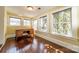 Sunlit bedroom with hardwood floors and natural light streaming through multiple windows; ideal workspace at 234 N Race St, Statesville, NC 28677