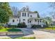 Well-maintained two-story home boasting a covered porch, manicured lawn, and classic architectural style at 234 N Race St, Statesville, NC 28677