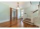 Open foyer with hardwood floors, chandelier and traditional staircase at 234 N Race St, Statesville, NC 28677