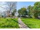 Landscaped front yard with lush green grass and a sidewalk leading to the home at 234 N Race St, Statesville, NC 28677