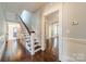 Hallway featuring hardwood floors and stairway at 234 N Race St, Statesville, NC 28677