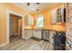 Well-lit kitchen with modern appliances, wooden cabinets, and a window providing ample natural light at 234 N Race St, Statesville, NC 28677