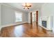 Cozy living room with fireplace, hardwood floors, and natural light at 234 N Race St, Statesville, NC 28677