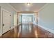 Bright living room featuring hardwood floors, ample natural light, and classic architectural details at 234 N Race St, Statesville, NC 28677