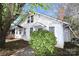 Charming two-story home with white siding, covered entry, and lush landscaping adding curb appeal at 234 S Ervin Ave, Newton, NC 28658