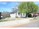 Classic two-story home with a well-manicured front yard, mature trees, and inviting curb appeal at 234 S Ervin Ave, Newton, NC 28658