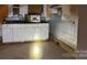 Basic kitchen with white cabinets and laminate countertops at 2501 Booker Ave, Charlotte, NC 28216