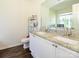 Bright bathroom with double sinks, granite countertops, and white cabinets at 2518 Eargle Rd, Charlotte, NC 28269