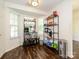 Bright breakfast nook features shelving and ample room to enjoy morning coffee at 2518 Eargle Rd, Charlotte, NC 28269