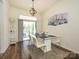 Bright dining room with modern table and chairs, pendant lighting, and sliding glass door access to patio at 2518 Eargle Rd, Charlotte, NC 28269