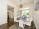 Cozy dining area with modern table, stylish chandelier, and access to outdoor space, stainless steel appliances at 2518 Eargle Rd, Charlotte, NC 28269