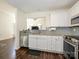 Modern kitchen with stainless steel appliances, granite countertops, and ample cabinet space at 2518 Eargle Rd, Charlotte, NC 28269