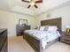 Main bedroom features a tray ceiling, neutral colors, and an ensuite bathroom at 2518 Eargle Rd, Charlotte, NC 28269