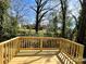 New wood deck with railing overlooking private backyard at 347 Sidney St, Rock Hill, SC 29730