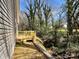 Gray home with new back deck and newly seeded backyard and retaining wall at 347 Sidney St, Rock Hill, SC 29730