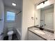 Bathroom with modern fixtures, granite vanity, and shower-tub combo at 347 Sidney St, Rock Hill, SC 29730