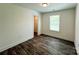 Bedroom with vinyl wood floors, large window, and closet at 347 Sidney St, Rock Hill, SC 29730