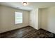 Cozy bedroom with wood-look flooring and a bright window with a view of the outdoors at 347 Sidney St, Rock Hill, SC 29730