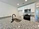 Close up on modern kitchen featuring granite countertops, stainless steel appliances, and a stylish sink at 347 Sidney St, Rock Hill, SC 29730