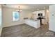 Modern kitchen with white cabinets, granite countertops, and stainless steel appliances at 347 Sidney St, Rock Hill, SC 29730