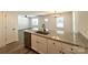 Well-designed kitchen island with granite countertop, stainless steel sink, and modern hardware at 347 Sidney St, Rock Hill, SC 29730