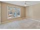 Sunlit bedroom with neutral walls, large window, and plush carpeting for a cozy atmosphere at 419 W 8Th St, Charlotte, NC 28202