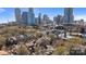 Panoramic view of the city skyline, surrounded by lush trees and various residential buildings at 419 W 8Th St, Charlotte, NC 28202