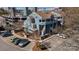 Aerial view of modern, blue townhouses with a well-maintained parking lot and landscaping at 419 W 8Th St, Charlotte, NC 28202