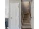 Hallway with view of carpeted stairs and entry to kitchen at 419 W 8Th St, Charlotte, NC 28202