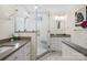 Modern bathroom with a glass-enclosed shower, white cabinets, and gray countertops at 4329 Castleton Rd, Charlotte, NC 28211