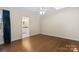 Clean, empty bedroom with hardwood flooring and natural light at 4329 Castleton Rd, Charlotte, NC 28211