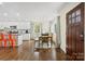 Stylish kitchen opens to dining area with an island and stainless steel appliances at 4329 Castleton Rd, Charlotte, NC 28211