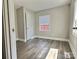 Bedroom with wood floors, neutral paint and one window providing ample natural light at 507 E Maple Ave, Gastonia, NC 28054