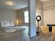 A charming bedroom with neutral walls, carpet, a window, and a touch of modern decor at 507 E Maple Ave, Gastonia, NC 28054