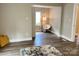 Bright living room featuring wood floors, neutral walls, and ample natural light streaming through the window at 507 E Maple Ave, Gastonia, NC 28054