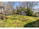 Backyard view with shed, and green grass at 512 Washington St, Cramerton, NC 28032