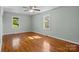 Bedroom has hardwood floors, ceiling fan and windows that bring in natural light at 512 Washington St, Cramerton, NC 28032