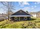 Rear home elevation showing gray siding and white trim and green lawn at 512 Washington St, Cramerton, NC 28032