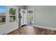 Foyer with hardwood floors, a bright window, and an open front door at 512 Washington St, Cramerton, NC 28032