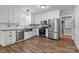 Modern kitchen featuring white cabinets, stainless appliances, and hardwood floors at 512 Washington St, Cramerton, NC 28032