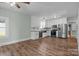 Bright kitchen with white cabinets, stainless appliances, and hardwood floors at 512 Washington St, Cramerton, NC 28032