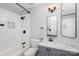 Bright bathroom with white subway tile, gray vanity, and modern fixtures at 6087 Diamond Pl, Harrisburg, NC 28075