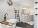 Modern bathroom with a freestanding tub, dual vanity, and a stylish ladder for towels at 6087 Diamond Pl, Harrisburg, NC 28075