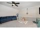 Spacious bonus room with ceiling fan and comfortable seating area at 6087 Diamond Pl, Harrisburg, NC 28075