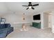 Inviting bonus room featuring a large TV, sofa and neutral color scheme at 6087 Diamond Pl, Harrisburg, NC 28075